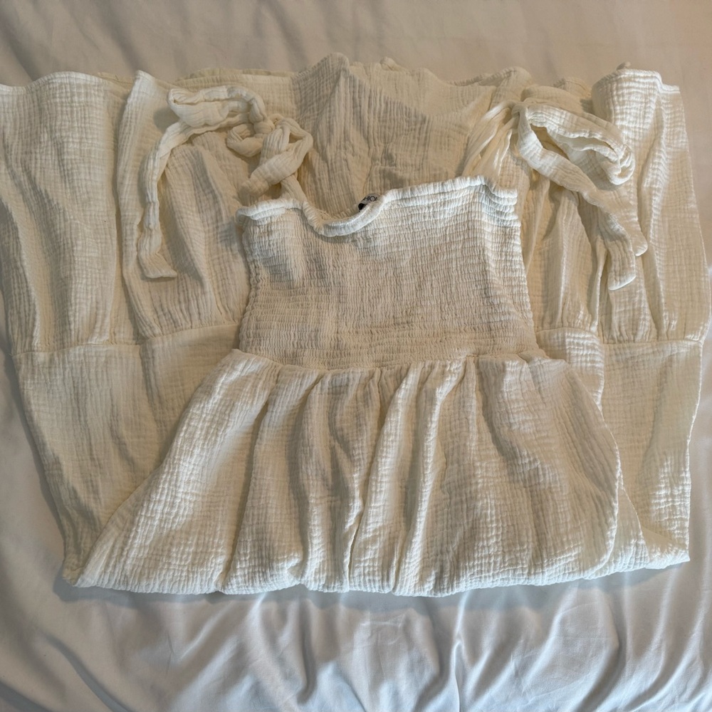 White Sleeveless Dress with Ruffle Details
